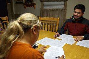 A CPS adoption worker with a client